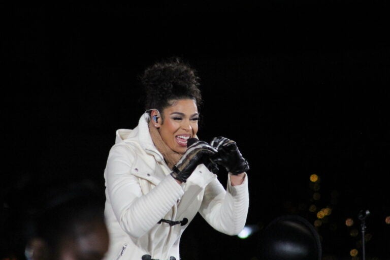 Jordin Sparks sings into a microphone