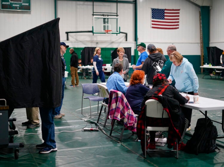 Voters check in at their polling place before casting their ballots on election day in Philadelphia, Tuesday, Nov. 7, 2023.