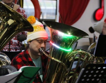 All types of horns could be seen and heard during the TubaChristmas concert at Cherry Street Pier on Dec. 17, 2023. (Cory Sharber/WHYY)