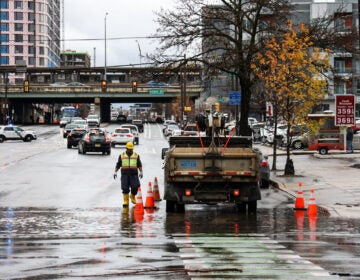 File photo: Clogged gutters at Delaware Ave. and Spring Garden Street in Philadelphia cause road closures after a storm brought heavy rain to the region and the Delaware River overflowed onto the road on December 18, 2023. (Kimberly Paynter/WHYY)