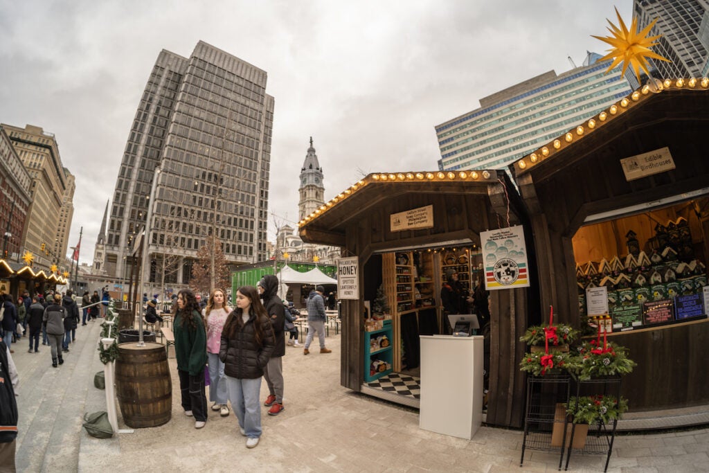 Local makers Vellum Street Soap Company and the Philadelphia Bee Company set up at Christmas Village at Love Park