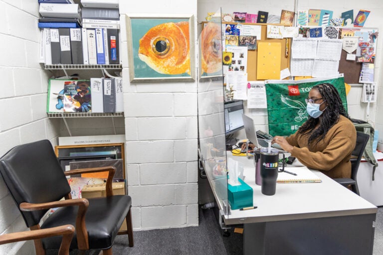 Kharisma Goldston working at her desk