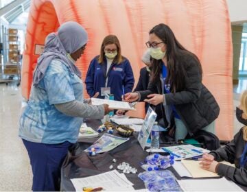 Temple Health physicians and providers hand out FIT take home kits for stool-based colorectal cancer screenings. (Courtesy of Temple Health)