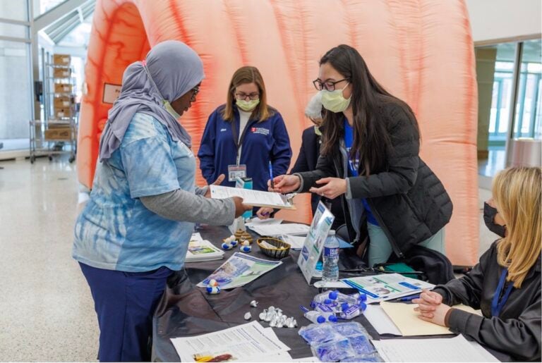 Temple Health physicians and providers hand out FIT take home kits for stool-based colorectal cancer screenings. (Courtesy of Temple Health)