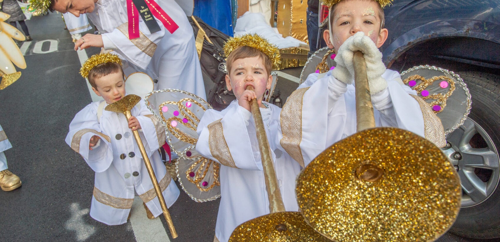 Children dressed up as angels for the Mummers Parade