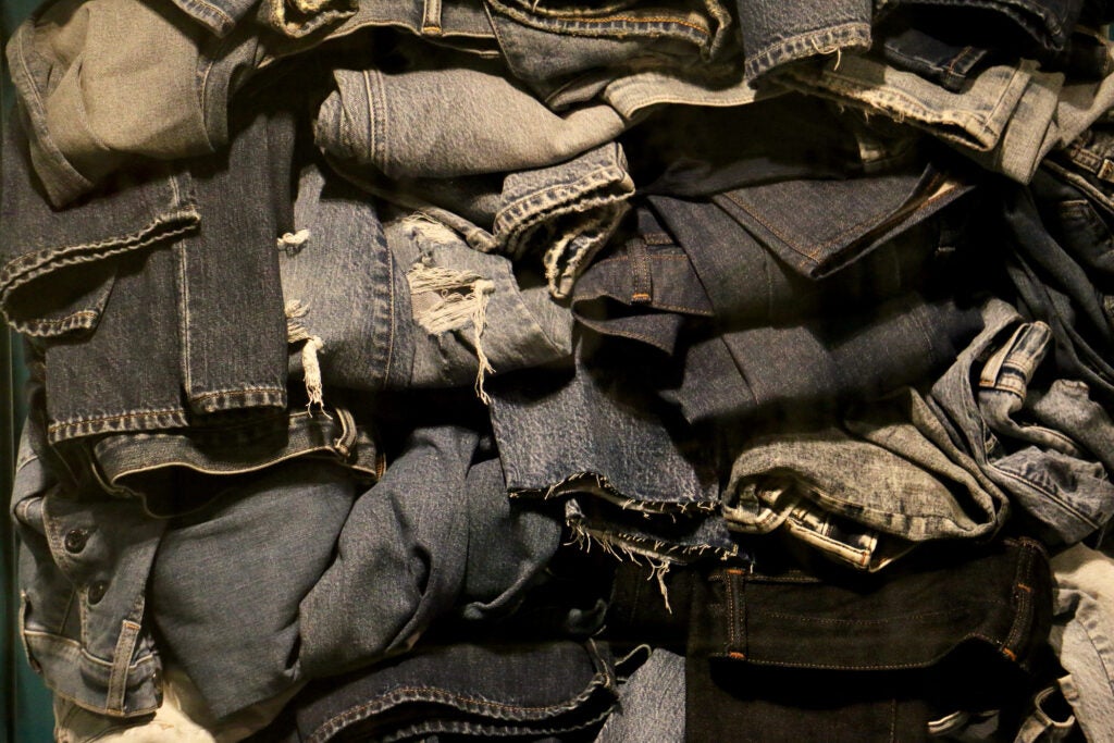 A close-up of a pile of blue jeans