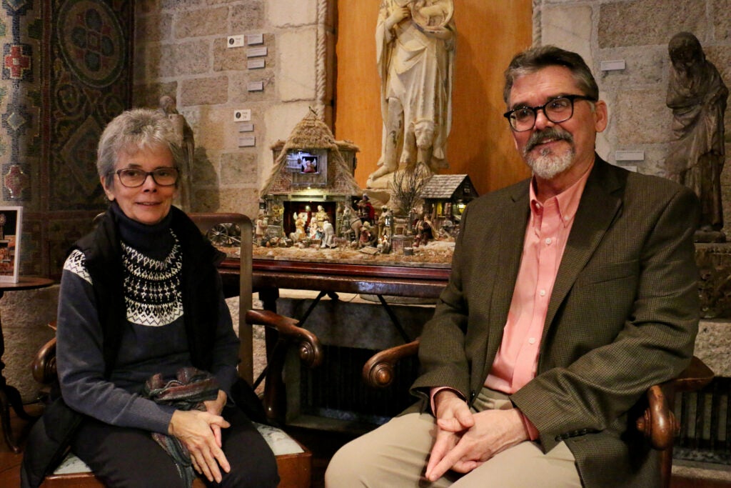 Karen Loccisano and Michael Palan pose in front of their nativity scene on display