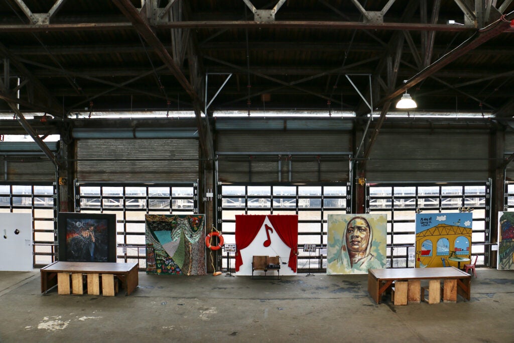 A view of paintings on display at the Cherry Street Pier