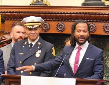 Incoming Philadelphia Chief Public Safety Director Adam Geer (right) speaks at the appointment announcement for him and soon-to-be Acting Fire Commissioner Craig Murphy (left). (Tom MacDonald/WHYY)
