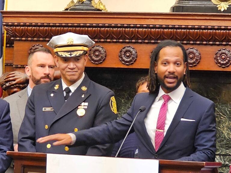 Incoming Philadelphia Chief Public Safety Director Adam Geer (right) speaks at the appointment announcement for him and soon-to-be Acting Fire Commissioner Craig Murphy (left). (Tom MacDonald/WHYY)
