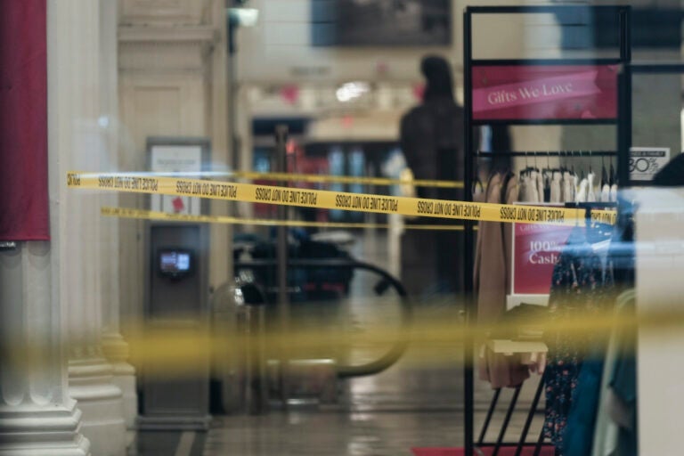 Police tape is seen inside of a the Macy's retail location after reports of an alleged stabbing at the department store