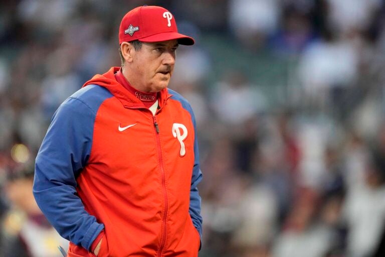 Philadelphia Phillies Manager Rob Thomson walks to the mound during the fourth inning of Game 1 of a baseball NL Division Series against Atlanta Braves, Oct. 7, 2023, in Atlanta.