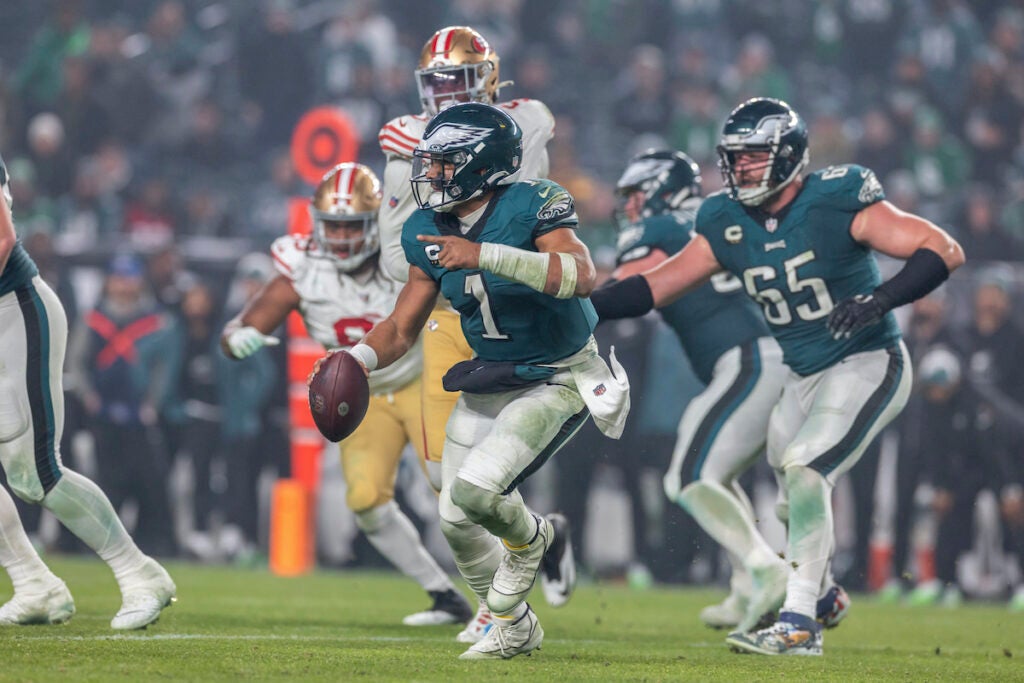 Philadelphia Eagles quarterback Jalen Hurts (1) rolls out against the San Francisco 49ers in an NFL football game, Sunday, Dec. 3, 2023, in Philadelphia, PA.