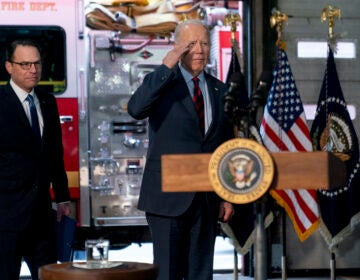 President Joe Biden, accompanied by Pennsylvania Gov. Josh Shapiro (left) salutes firefighters in the audience as he arrives at Engine 13 in Philadelphia, Monday, Dec. 11, 2023, for an event recognizing that the city of Philadelphia is receiving a 22.4 million dollar SAFER Grant, that enables the Philadelphia Fire Department to reopen three fire companies. (AP Photo/Andrew Harnik)