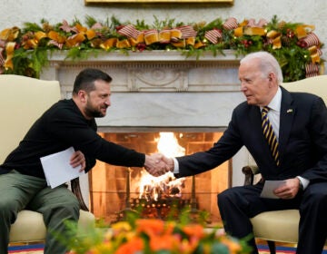 President Joe Biden shakes hands with Ukrainian President Volodymyr Zelenskyy as they meet in the Oval Office of the White House, Tuesday, Dec. 12, 2023, in Washington.