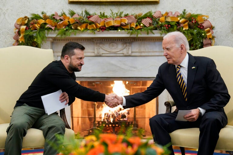 President Joe Biden shakes hands with Ukrainian President Volodymyr Zelenskyy as they meet in the Oval Office of the White House, Tuesday, Dec. 12, 2023, in Washington.