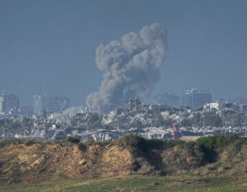 Smoke rises following an Israeli bombardment in the Gaza Strip, as seen from southern Israel, Sunday, Dec. 24, 2023. The army is battling Palestinian militants across Gaza in the war ignited by Hamas' Oct. 7 attack into Israel.