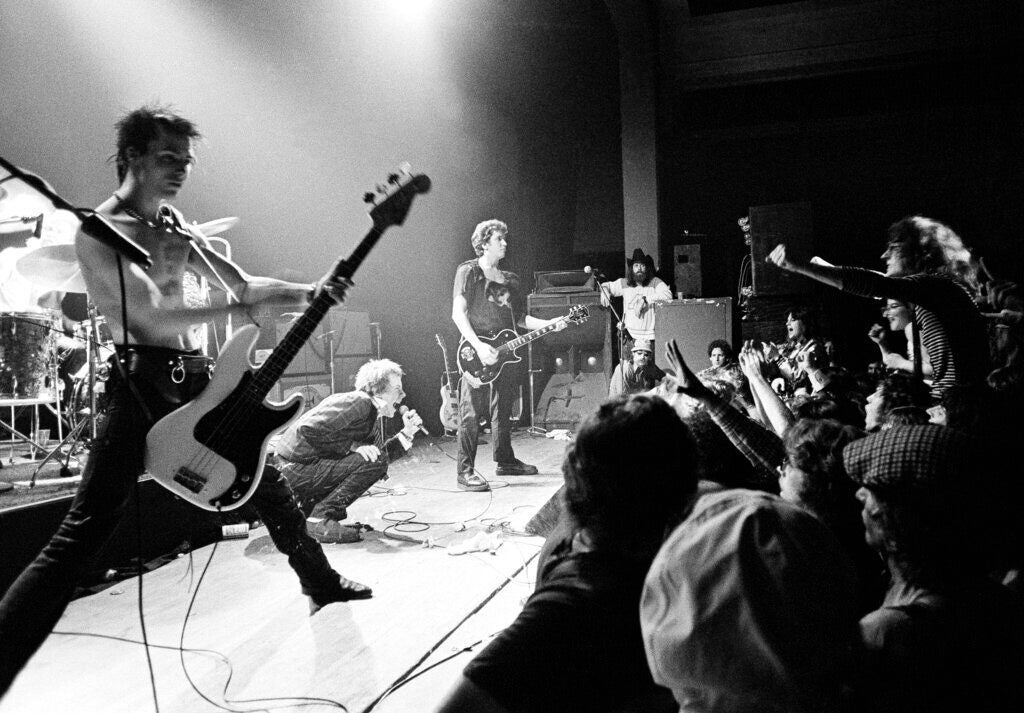 English punk rock group "Sex Pistols" performs onstage in 1978 black-and-white photo