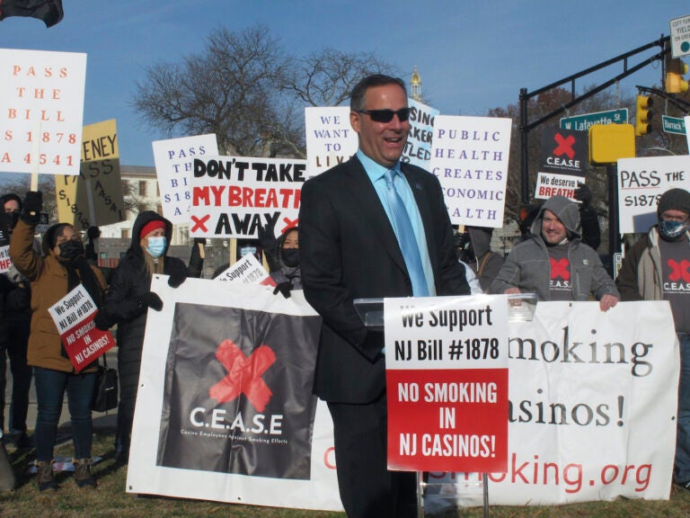 FILE - New Jersey state Senator Vince Polistina with Atlantic City casino workers protesting near the state capitol in Trenton N.J. in support of legislation that would ban smoking in Atlantic City's casinos, Dec. 9, 2021. State Sen. Vince Polistina said on Dec. 14, 2023, that legislation lacks enough support to become law, and said he will write a new bill incorporating proposals form the casino industry, including enclosed smoking rooms. (AP Photo/Wayne Parry, File)