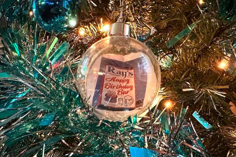 Customized ornaments decorate the Christmas tree at Ray's. (Ali Mohsen/Billy Penn)