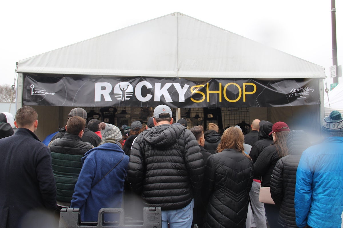 After Sylvester Stallone gave a speech, folks quickly gathered by the popup shop next to the stage to get their hands on some Rocky merch. (Cory Sharber/WHYY)