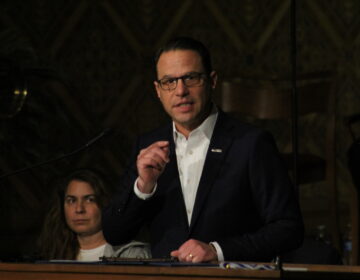 Pa. Gov. Josh Shapiro addressed the hundreds in the pews of Congregation Rodeph Shalom on Dec. 10, 2023 for an ''Interfaith Rally Against Antisemitism.'' (Cory Sharber/WHYY)