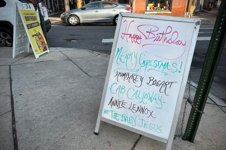 Ray's sandwich board is updated daily to display notable birthdates. (Ali Mohsen/Billy Penn)