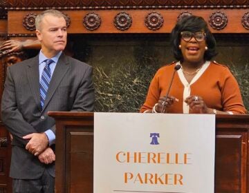 Managing director designee Adam Thiel looks on as Mayor-elect Cherelle Parker announces his appointment.