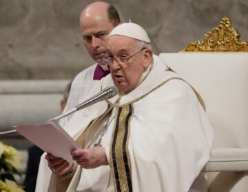 Pope Francis presides over Christmas eve Mass, at St. Peter's Basilica at the Vatican, on Sunday. (Gregorio Borgia/AP)