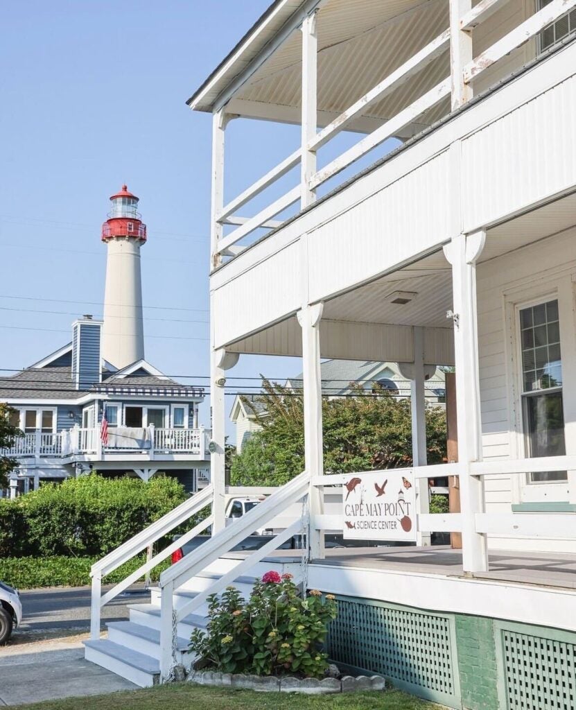The Cape May Lighthouse is seen in the background. In the foreground is the Cape May Point Science Center building.