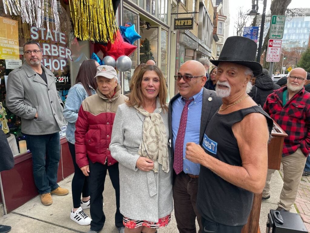 Maria Festa, Trenton Mayor Reed Gusciora, and Joe Festa, left to right, pose for a photo.