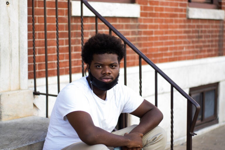 Darsen sitting outside on the steps