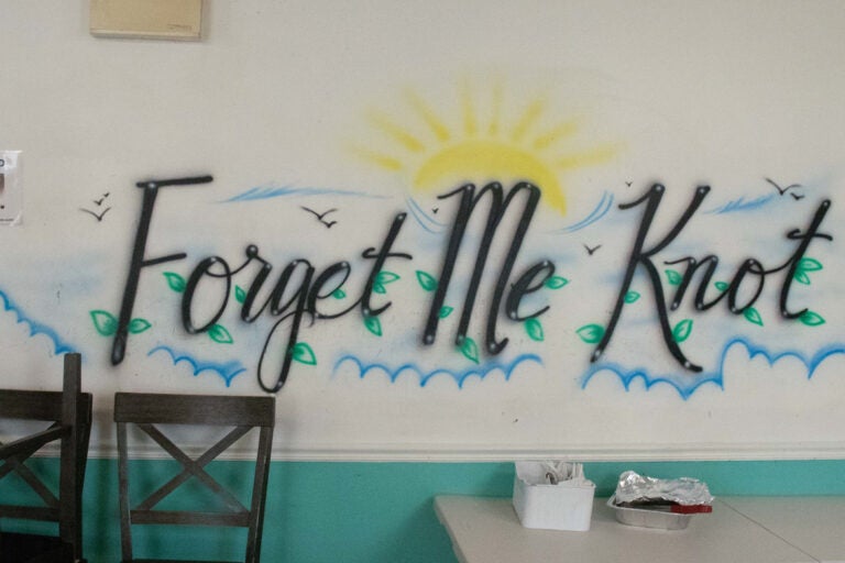 A mural saying Forget Me Knot on the wall