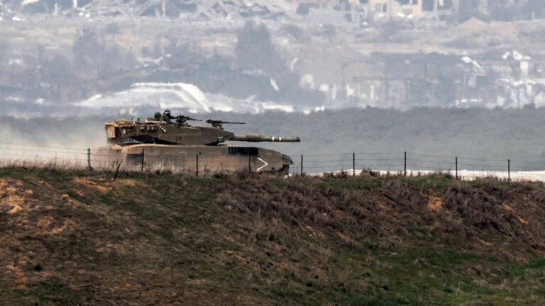 An Israeli battle tank moves along the border between the Gaza Strip and southern Israel on Wednesday as battles between Israel and Hamas continue. (Jack Guez/AFP via Getty Images)