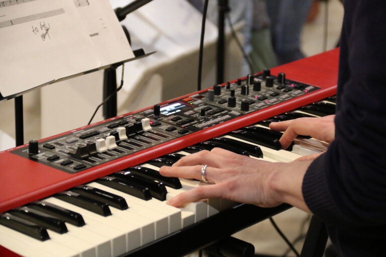An up-close view of a person playing the keyboard.
