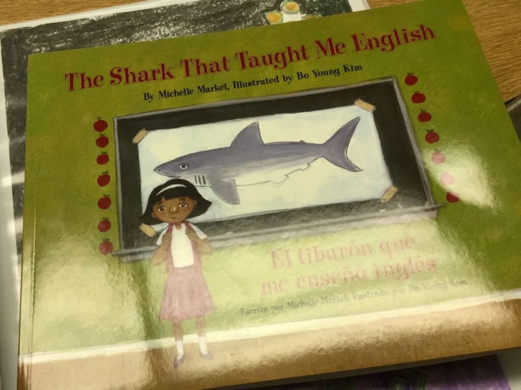 A book with a title that reads "The Shark that taught me English"