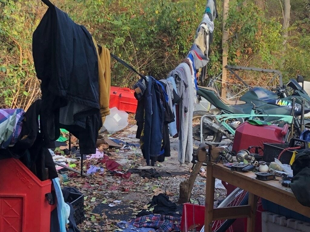 clothes hanging up at an encampment