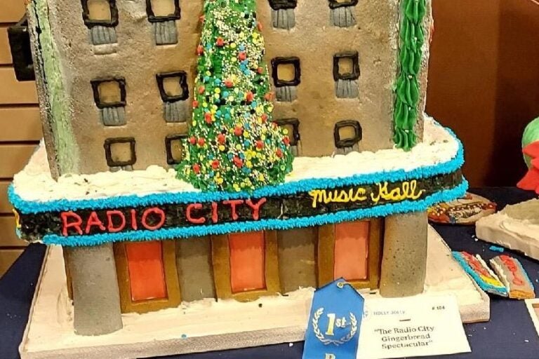 A gingerbread house decorated as Radio City Music Hall.