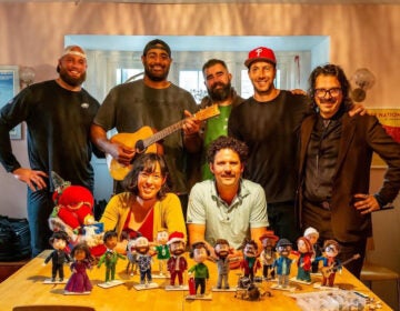Peter Heacock and Marie Hart of unPOP Animations with Philadelphia Eagles players and the puppets created for the stop-motion animated video.