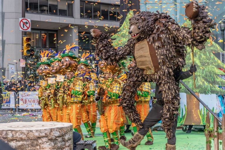 The Greater Kensington String Band performs for spectators at City Hall during the 2024 Mummers parade in Philadelphia.