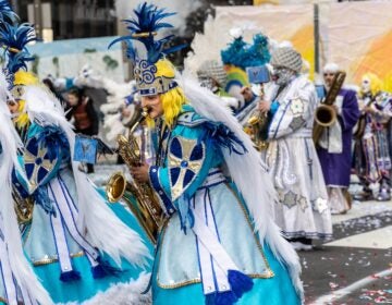 A member of the Ferko String Band plays the saxophone at the 2024 Mummers parade in Philadelphia.