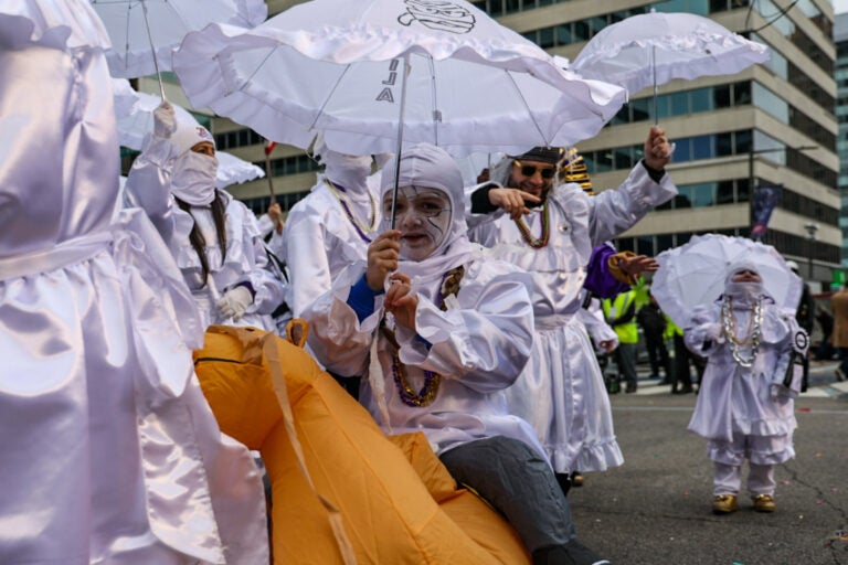 Mummers dressed as mummies march in the Mummers Parade