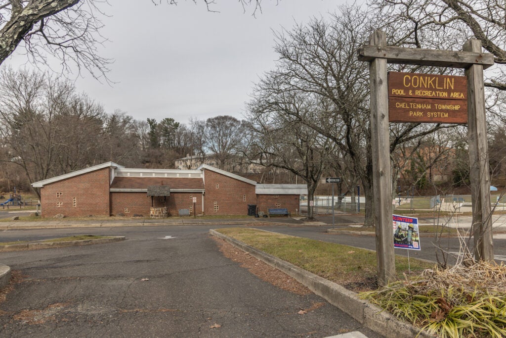 A sign reads Conklin Pool & Recreation area. A low brick building is visible in the background.