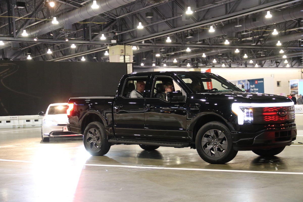 Attendees can get behind the wheel of various vehicles at the Philadelphia Auto Show, including a Ford F-150 Lightning electric truck.