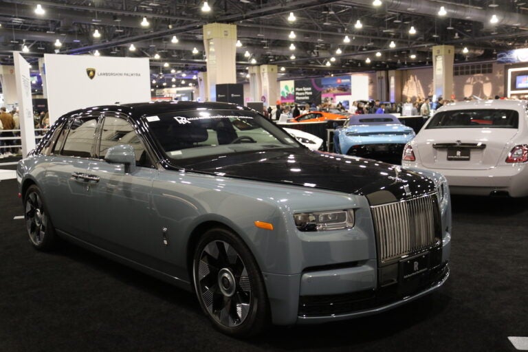 Multiple exotic vehicles are on display at the Philadelphia Auto Show, including Lamborghinis and Rolls-Royces.