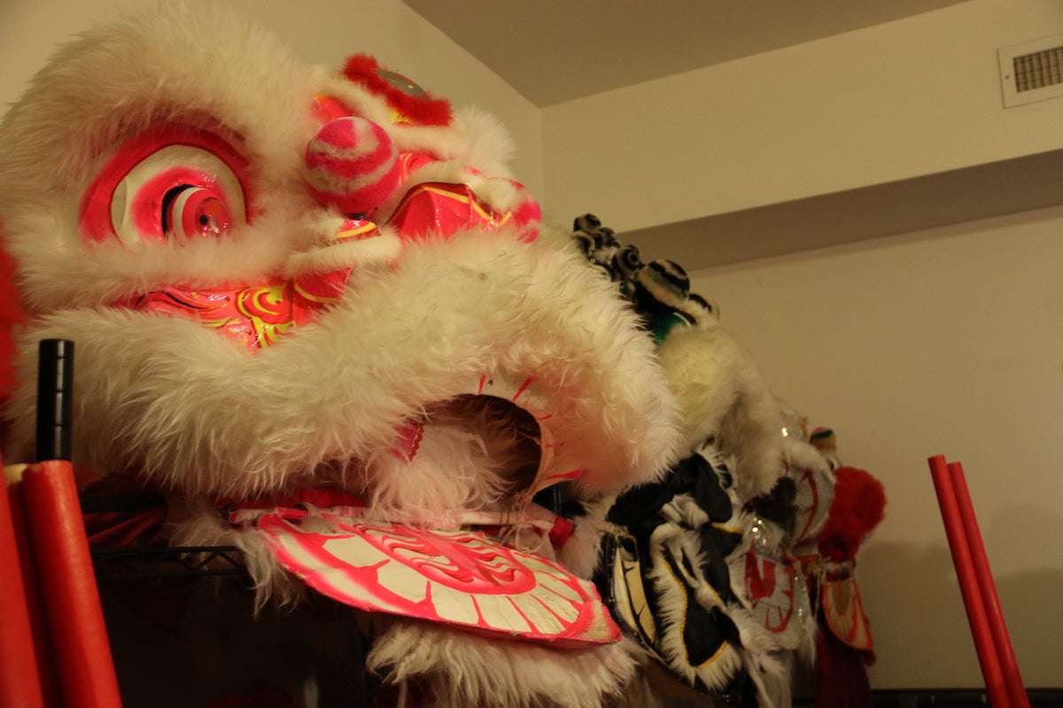 Lion masks at a rehearsal space in Chinatown are waiting to be donned as the Philadelphia Suns lion dance groups get ready for a series of scheduled performances including the Lunar New Year Parade. (Cory Sharber/WHYY)