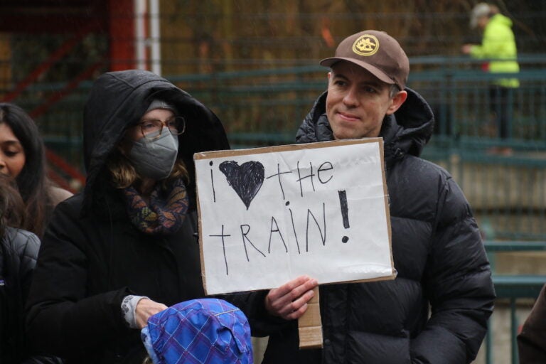 Community members across all ages made signs and showed their support for the Chestnut Hill West Regional Line during a ''rally and ride'' at the Richard Allen Lane SEPTA station on Jan. 28, 2024. (Cory Sharber/WHYY)