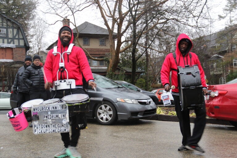 Drummers provided a funky rhythm as rally goers waited for the Chestnut Hill West train to arrive on Sunday. (Cory Sharber/WHYY)
