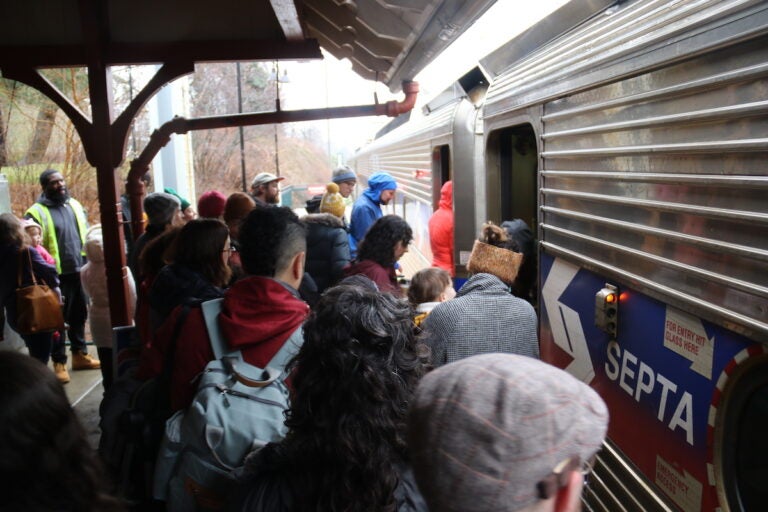 Despite the cramped situation at the Richard Allen Lane SEPTA station, the hundreds were easily able to board the Chestnut Hill West line. (Cory Sharber/WHYY)