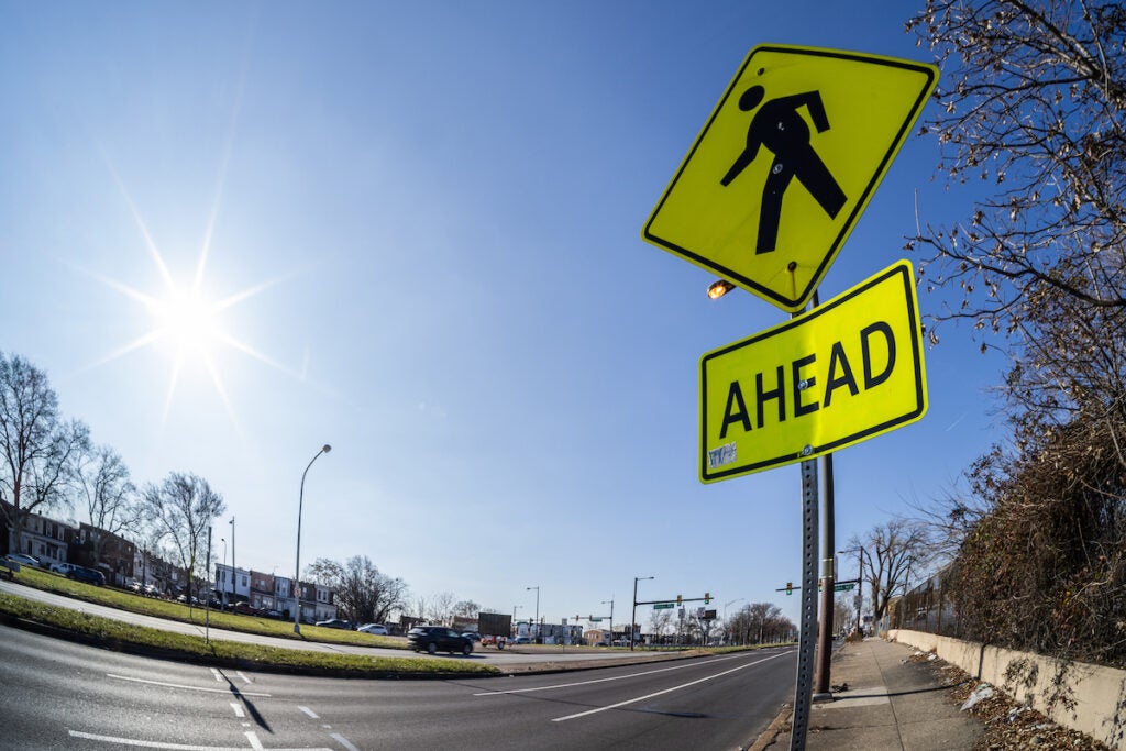 A pedestrian crossing sign by the side of Roosevelt Boulevard.